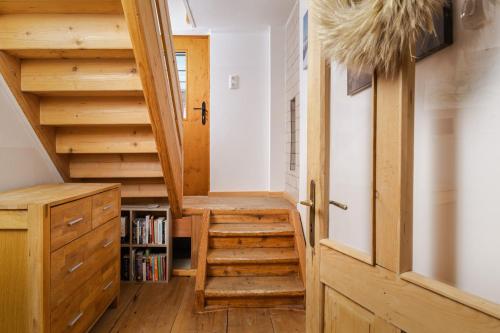 a staircase in a tiny house with wooden floors at Ferienhaus Altaussee - Your Austrian Home in Altaussee