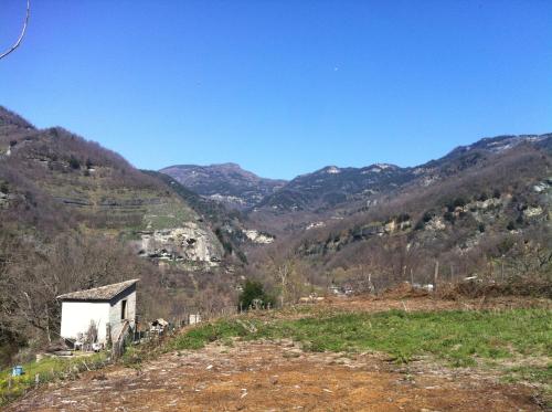 a view of a mountain with a house on a hill at Villa Silvia in Acquasanta Terme