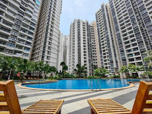 a swimming pool in the middle of tall buildings at Amberside, Country Garden Danga Bay Homestay by WELCOME HOME in Johor Bahru