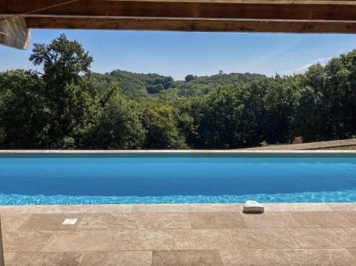 a view of a swimming pool from a house at Villa Charmante au Perigord 10p in Fouleix, Dord in Fouleix