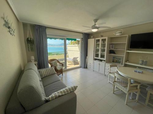 a living room with a couch and a table at Residencial Vistamar in Santoña