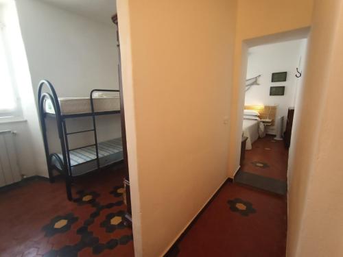a hallway with a bunk bed in a room at Borgo Antico - Casa del Caruggio in Tellaro