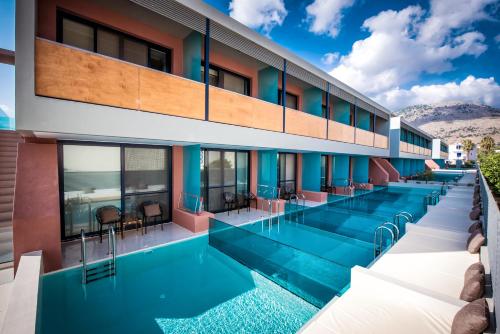 an image of a hotel with a swimming pool at Harmony Boutique Resort - Adults oriented in Georgioupolis