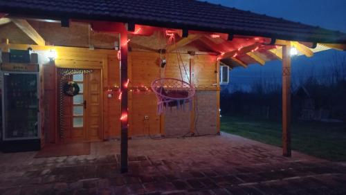 a house with a basketball hoop in front of it at Vikendica Jelena in Mionica
