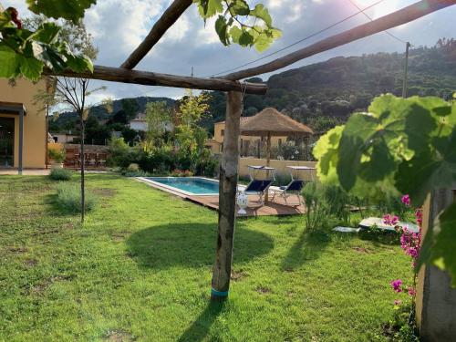 a view of a yard with a swimming pool at Villetta La Cellula in Casa Alzi