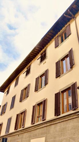 a building with brown shut windows at Oro Nero Florence in Florence