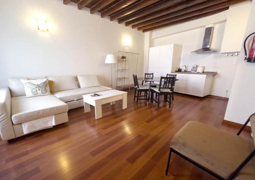 a living room with a couch and a table at ISA Granada in Granada