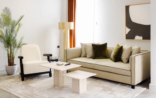 a living room with a couch and a table at Boutique Nest in New Cairo in Cairo