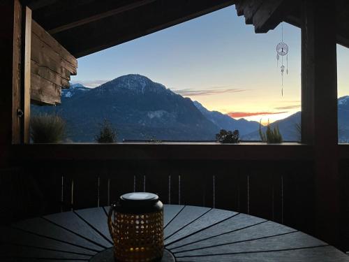 a room with a table with a view of a mountain at Bergmanns Ferienapartment in Debant