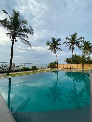 Bazén v ubytování Reef Bungalow Hotel nebo v jeho okolí