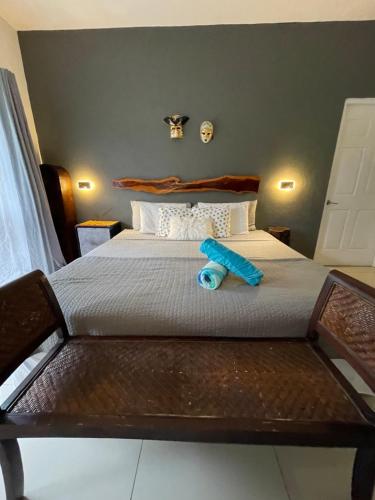a bed with a blue object sitting on top of it at Tamarindo Sunshine in Tamarindo