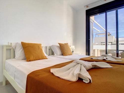 two beds sitting next to each other in a bedroom at Villa Sur - Sucina - 8409 in Sucina