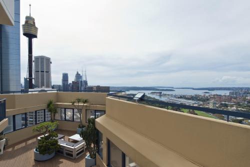 a balcony of a building with a view of the city at Park Regis City Centre in Sydney