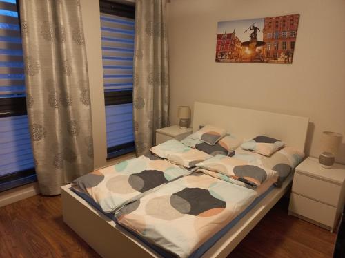 Voodi või voodid majutusasutuse Elegancki apartament Gdańsk Wrzeszcz toas