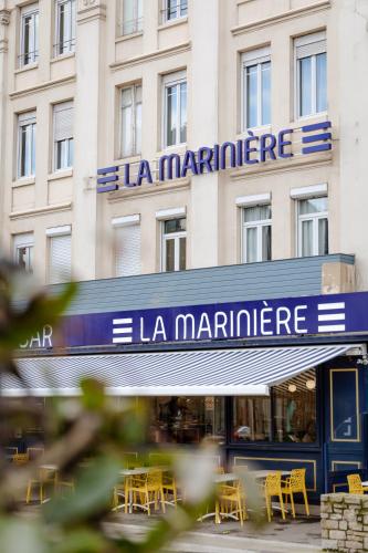 a building with a sign on the front of it at La Marinière Hôtel Restaurant in Saint Malo