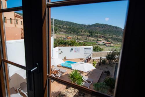 a view of a pool from a window at Hotel El Tejar & Spa in Vilaflor