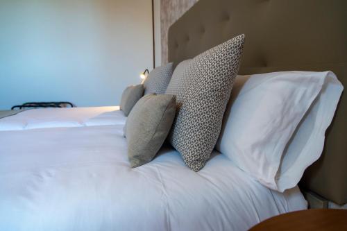 a bed with two pillows on top of it at Hotel El Tejar & Spa in Vilaflor