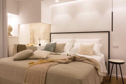 a bedroom with a large bed with a blanket on it at Zia Maria in Fasano