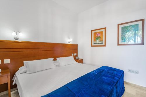 Säng eller sängar i ett rum på Don Juan Beach Resort