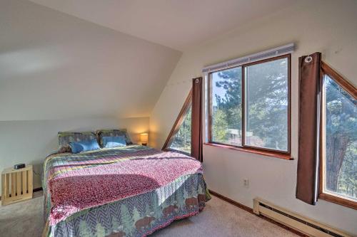 a bedroom with a bed and a large window at Divide Cabin in the Heart of Colorful Colorado! in Midland