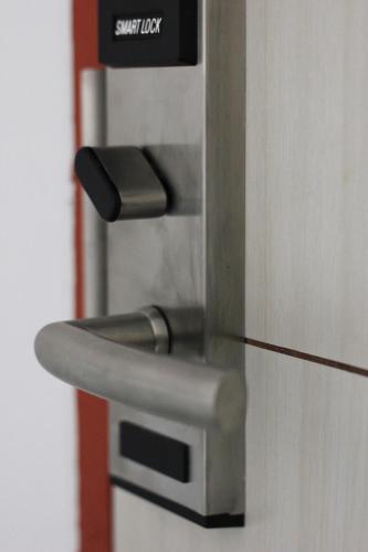 a close up of a door with a security lock at To Zleep Hotel Khaolak in Khao Lak