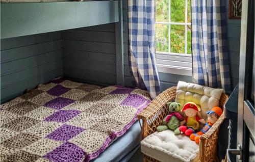 a childs room with a bunk bed with toys on it at Awesome Home In Laukvik With Kitchen in Laukvik
