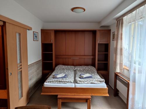 Postel nebo postele na pokoji v ubytování Tatran - Nika
