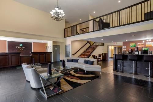a living room with a couch and a table at Quality Inn Phenix City Columbus in Phenix City