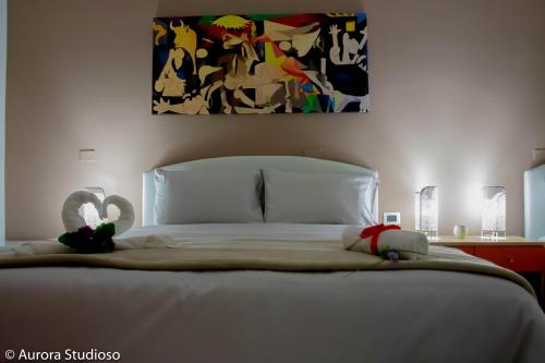 Postel nebo postele na pokoji v ubytování B&B L'incanto degli Artisti