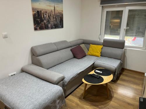 a living room with a couch and a table at Bamsae Belgrade in Vračar (historical)