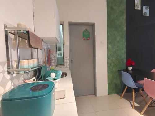 a kitchen and dining room with a table and chairs at Pavilionvillie M1T584 by irainbow in Simpang Pulai