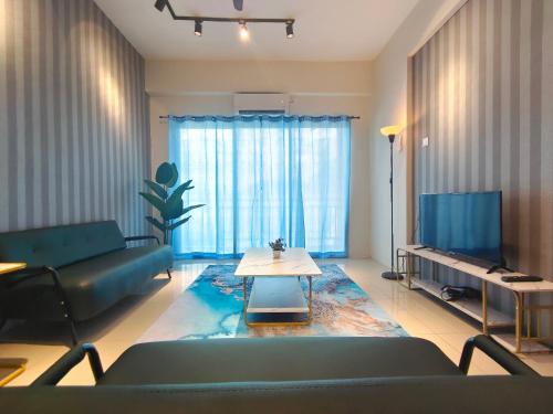 a living room with a couch and a table at Pavilionvillie M1T584 by irainbow in Simpang Pulai