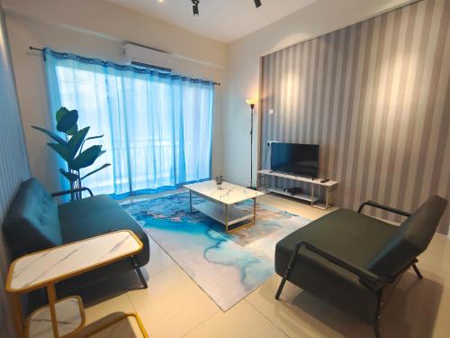 a living room with a couch and a table at Pavilionvillie M1T584 by irainbow in Simpang Pulai