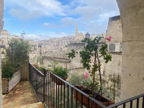 a view of the city from the balcony of a building at Residence Le Vie Del Mosto in Matera