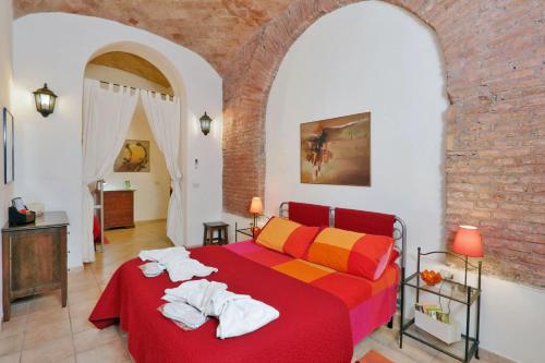 a bedroom with a bed with towels on it at Lucky Holidays in Rome