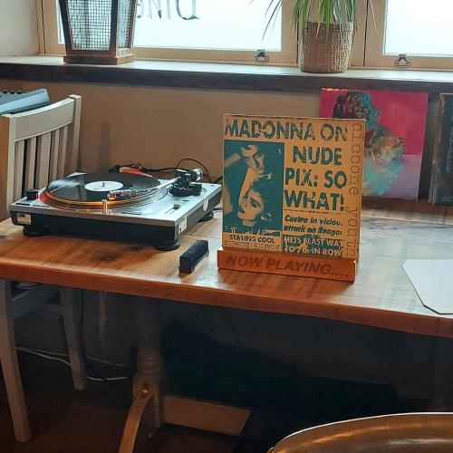 a radio on a table with a sign on it at Trawden Arms Community Owned Pub in Winewall