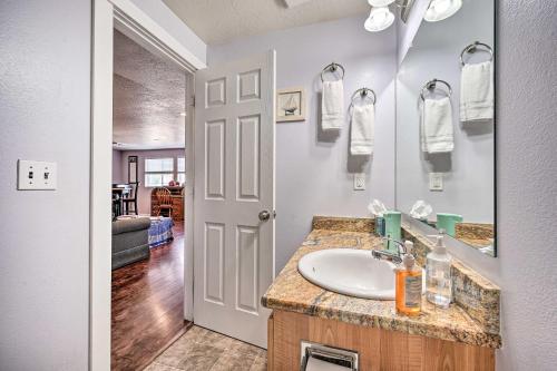 a bathroom with a sink and a mirror at Springfield Apt with Deck and Central Location! in Springfield