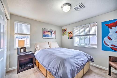 a bedroom with a bed and two windows at Springfield Apt with Deck and Central Location! in Springfield