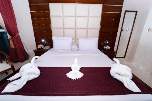 Katil atau katil-katil dalam bilik di Queen Palace Hotel
