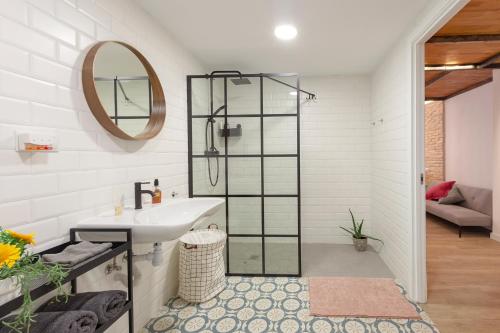 a bathroom with a sink and a mirror at B - NOGUERA APARTMENTS - ARTS AND SCIENCIES in Valencia