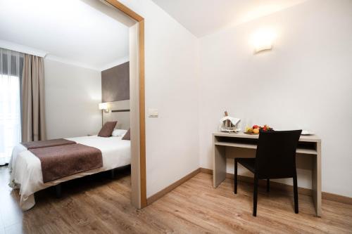  Hotel & Aparthotel Cosmos -  Room  picture :   Bath    Safety deposit box    TV                           