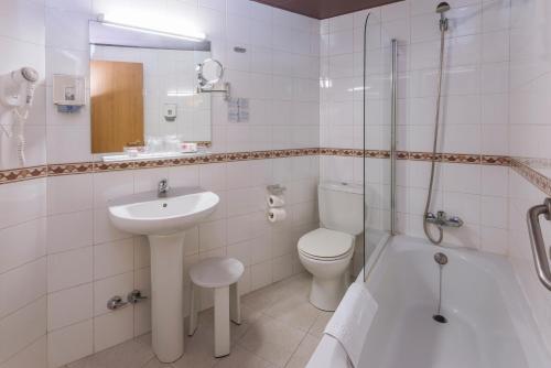  Hotel & Aparthotel Cosmos -  Room  picture :   Bath    Safety deposit box    TV                           