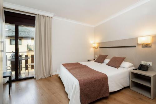  Hotel & Aparthotel Cosmos -  Room  picture :   Bath    Safety deposit box    TV                           