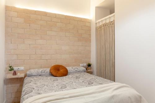 a bedroom with a bed with a pumpkin on it at C - NOGUERA APARTMENTS - ARTS AND SCIENCIES in Valencia