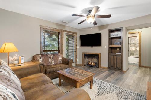 a living room with a couch and a fireplace at Table Rock Resorts at Indian Point in Branson