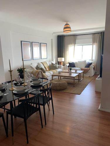 a living room with a table and a couch at Apartamento Luxury Mira Espanha na Guarda in Guarda