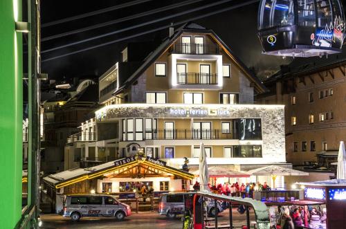 a large building with a lot of windows on top of it at Hotel Ferienglück in Ischgl
