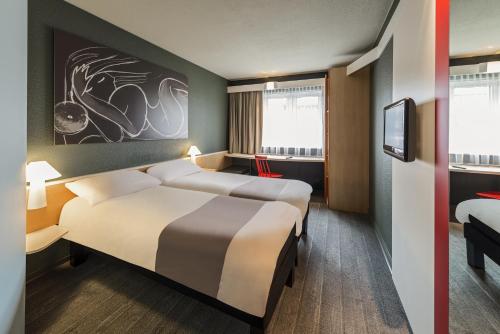 Ліжко або ліжка в номері ibis München Parkstadt Schwabing