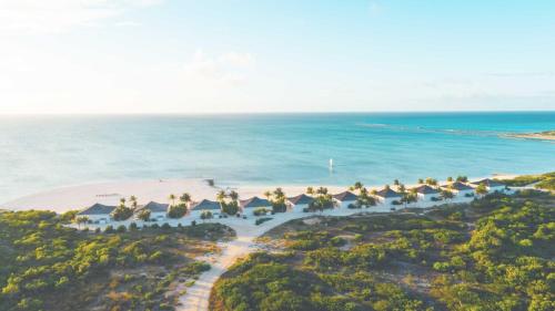 an aerial view of the resort and the ocean at Ambergris Cay Private Island All Inclusive in Big Ambergris Cay