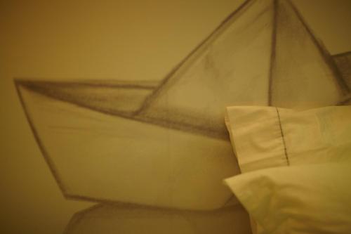 a close up of a pillow on a bed at Veritas Boutique Art Hotel in Veria